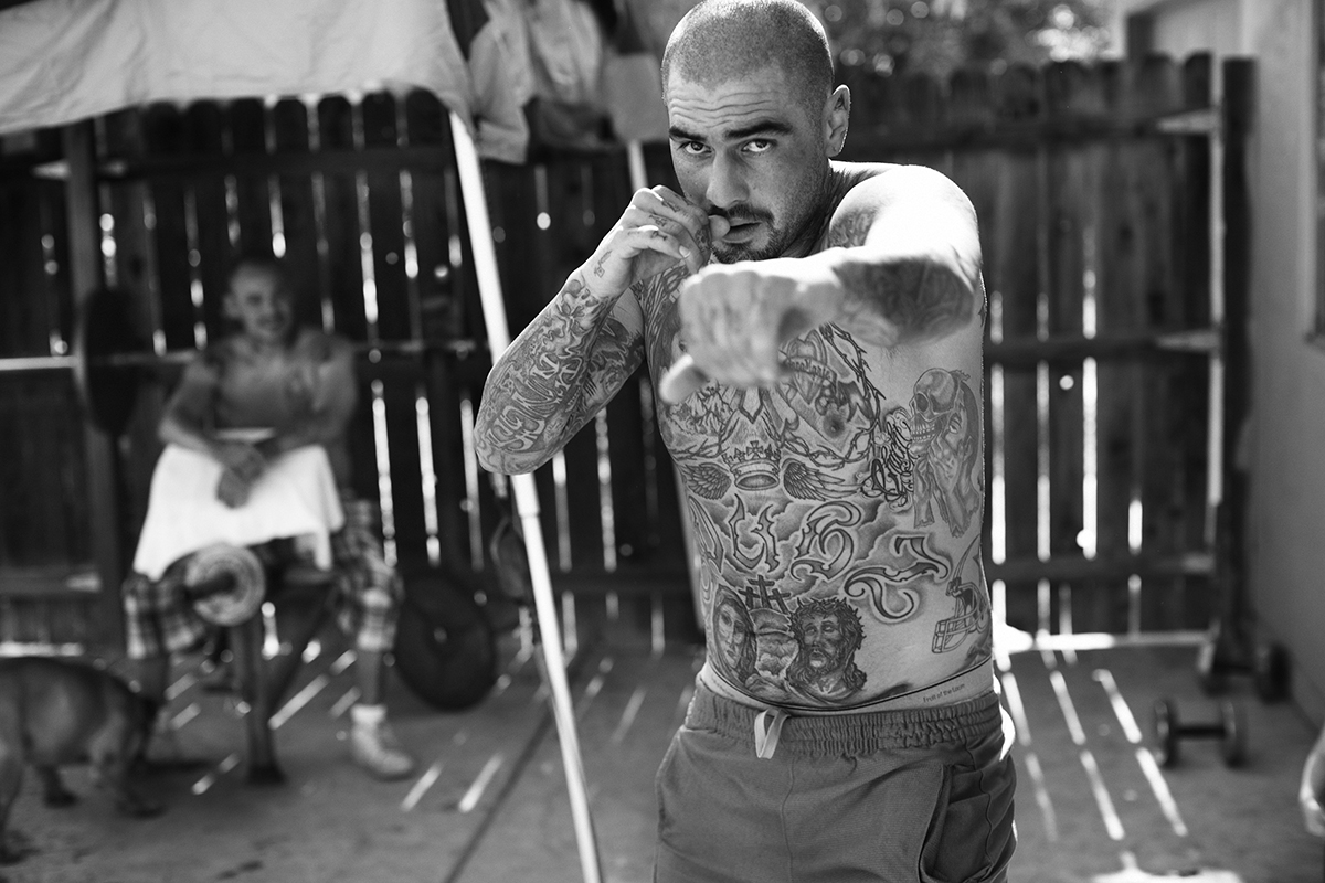 Mexican gangs characterized by tattoos and guns told by Jonathan May