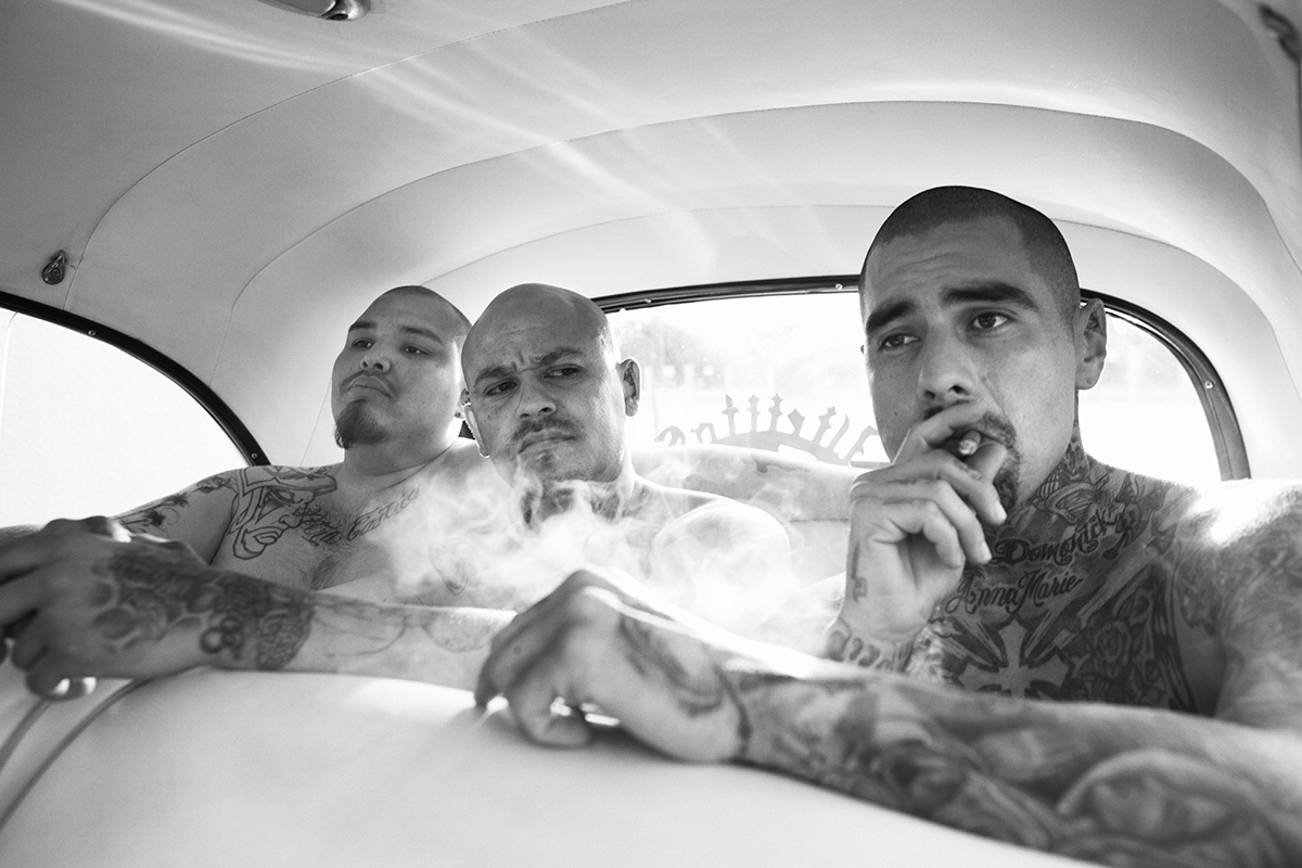 Mexican gangs characterized by tattoos and guns told by Jonathan May