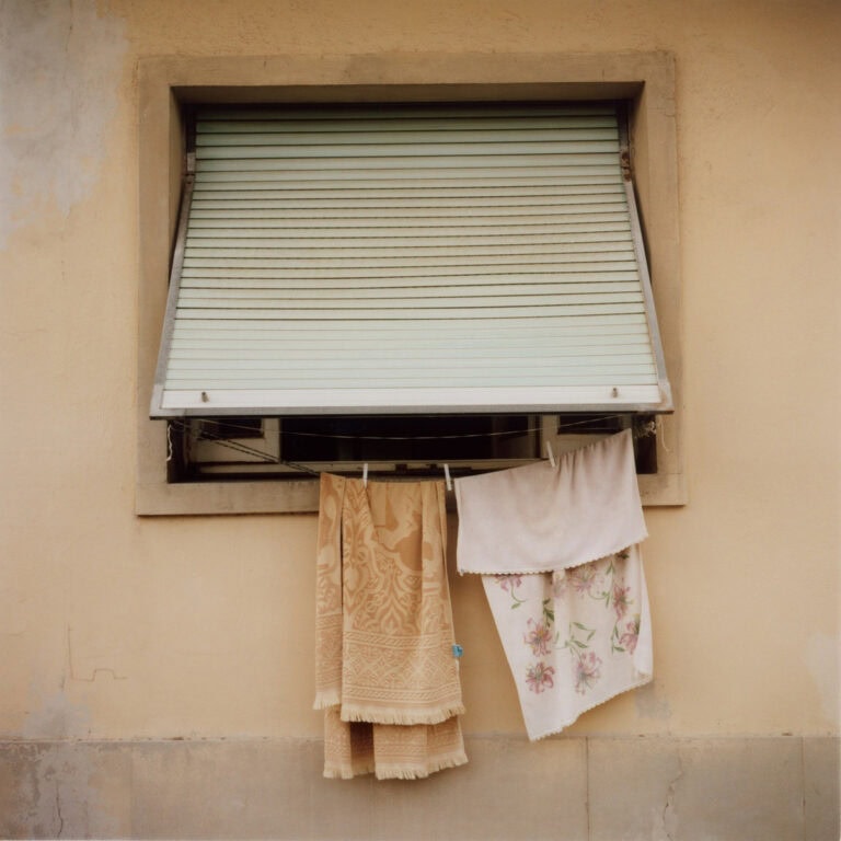Davide Cerretini strolls through a workers’ village at dusk